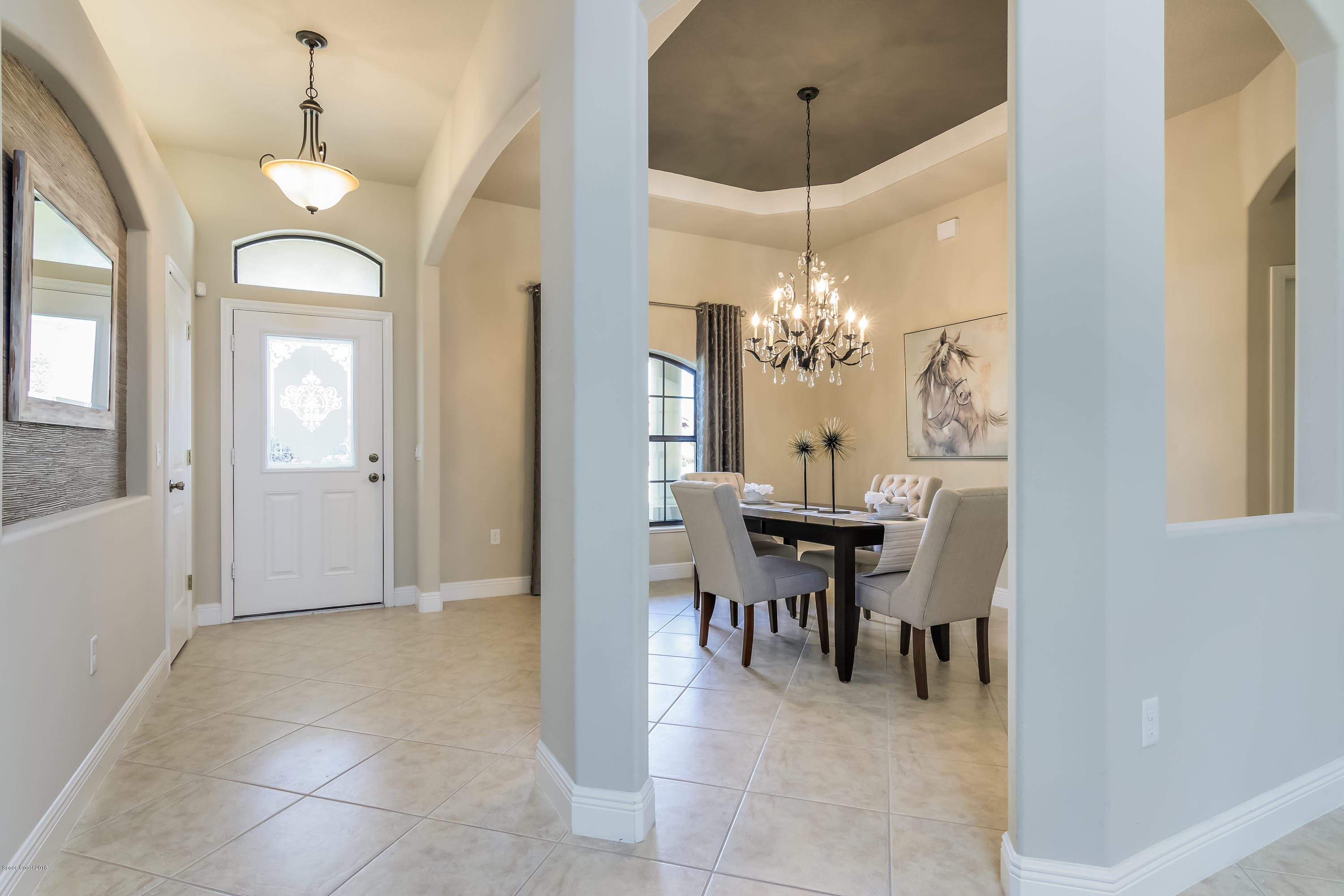 4025 Waterloo Place Melbourne, FL 32940 - Photo 6 of 29 a view of a dining room with furniture and chandelier