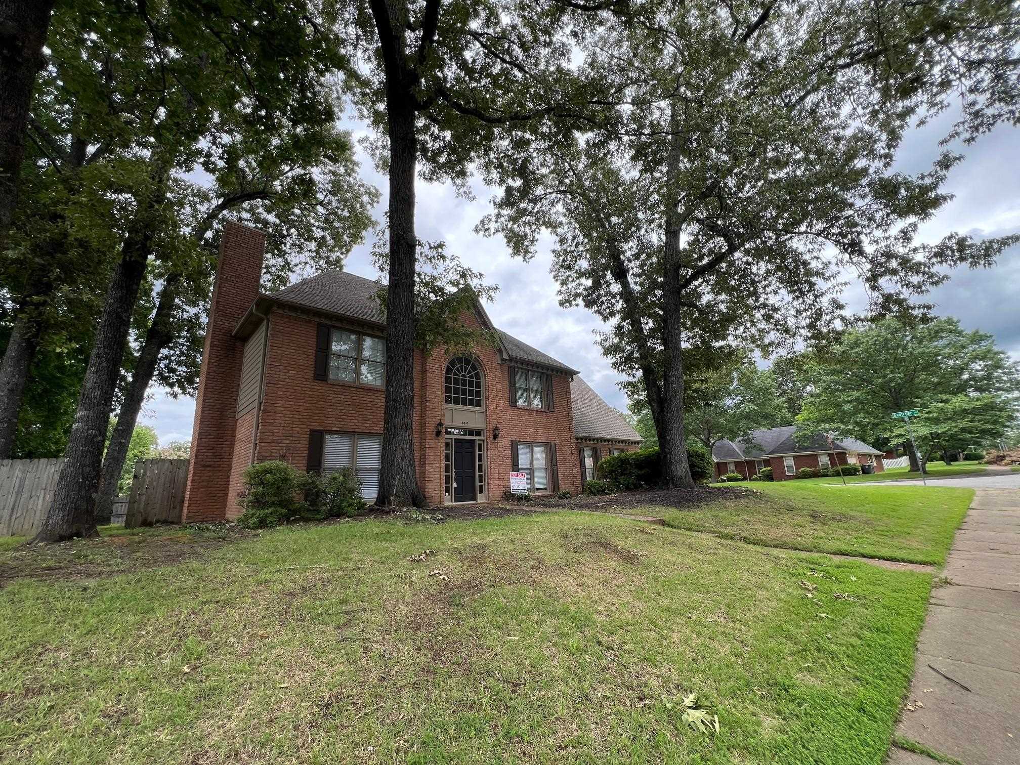 8810 Raspberry Lane Memphis, TN 38016 - Photo 1 of 28 Colonial home with a chimney and brick siding