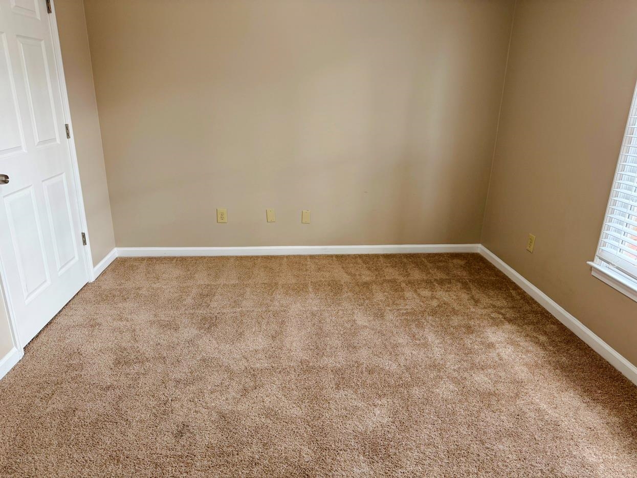 8810 Raspberry Lane Memphis, TN 38016 - Photo 24 of 28 Empty room featuring carpet flooring and baseboards