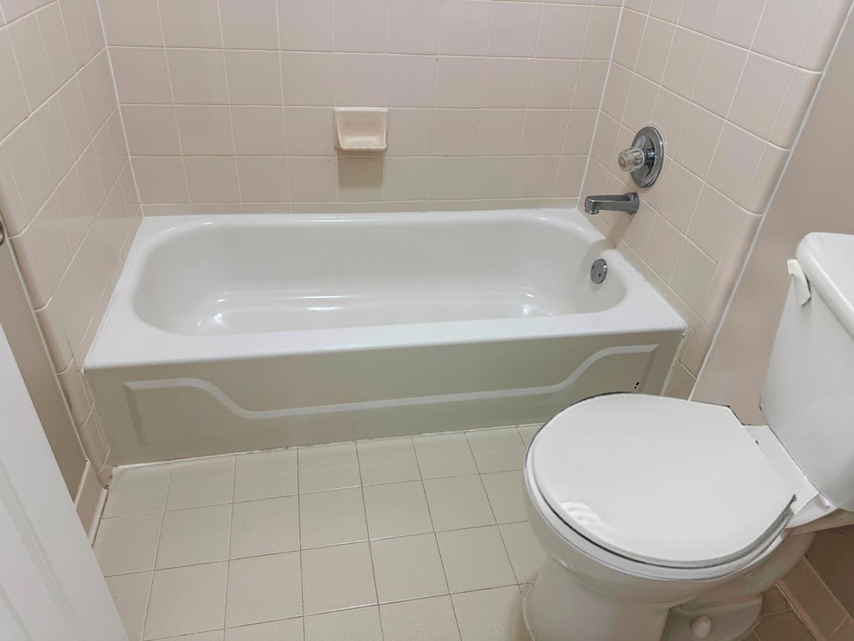 8810 Raspberry Lane Memphis, TN 38016 - Photo 27 of 28 Full bath with toilet, tile patterned flooring, and a bathtub