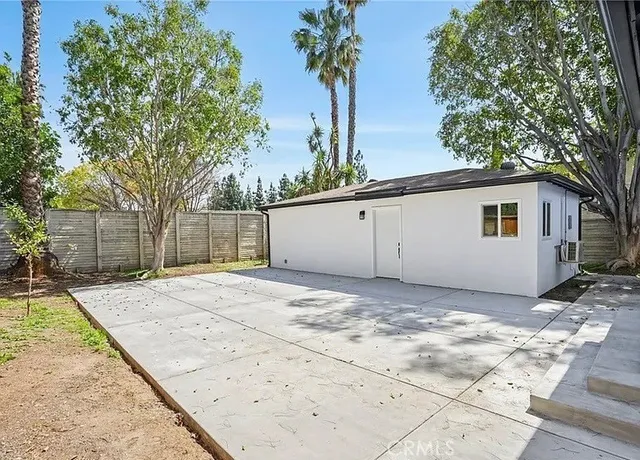 a view of backyard of a house