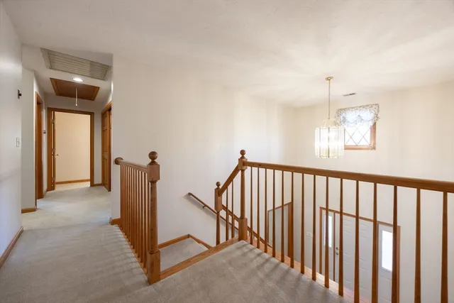 a view of a hallway with windows