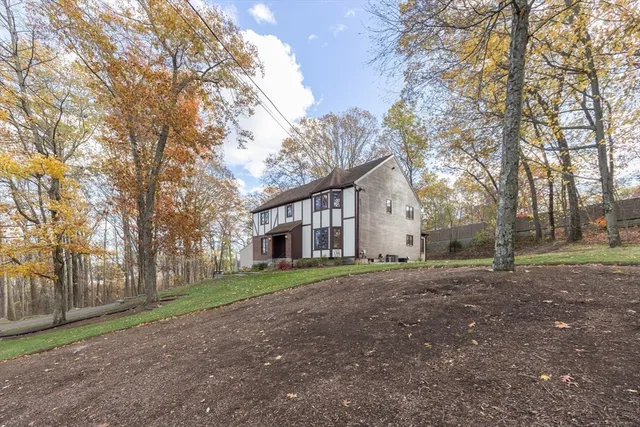 a big house with trees in front of it