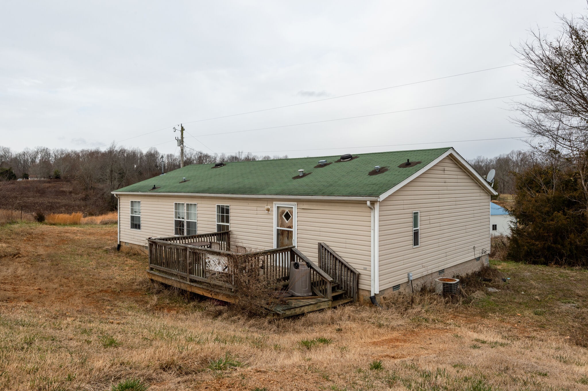 2848 Jack Teasley Road Pleasant View, TN 37146 - Photo 18 of 45 a view of a house with a backyard and a tree