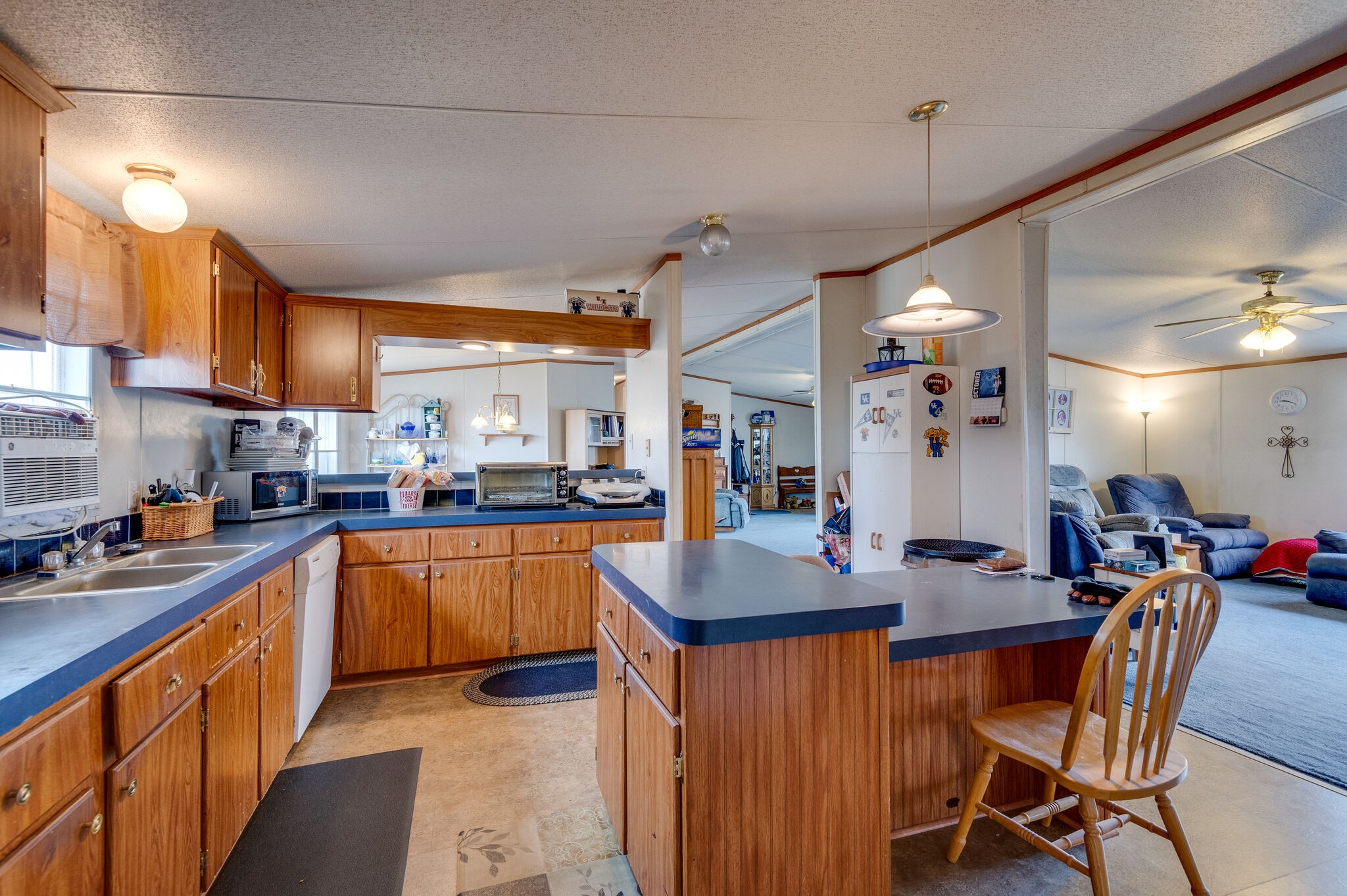 2848 Jack Teasley Road Pleasant View, TN 37146 - Photo 29 of 45 a kitchen with stainless steel appliances granite countertop a sink a stove a dining table and chairs