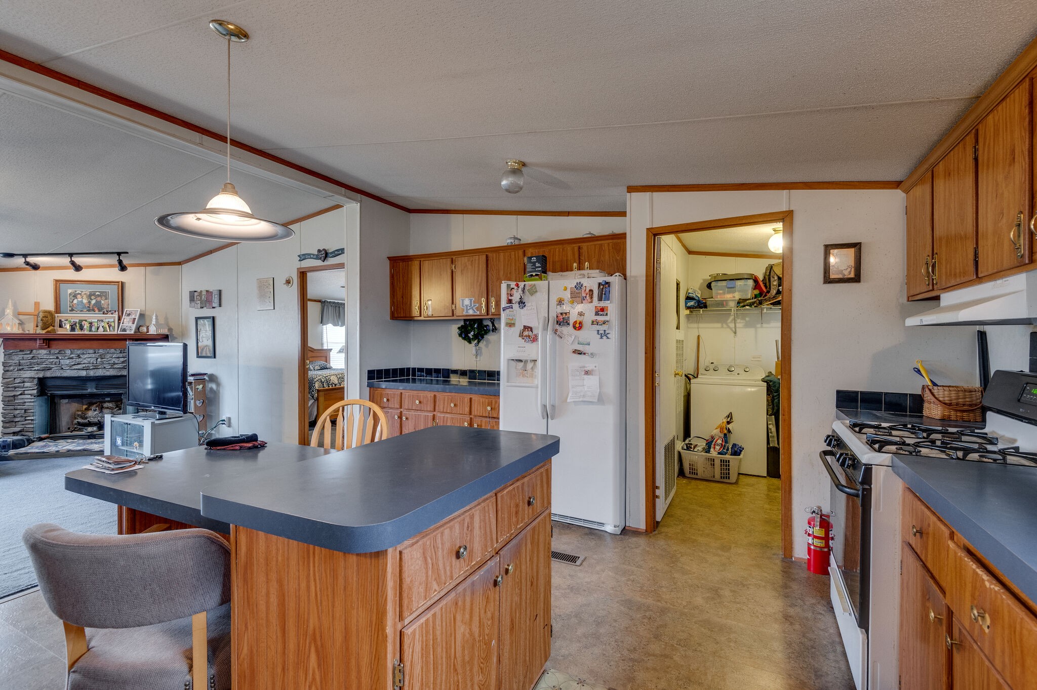 2848 Jack Teasley Road Pleasant View, TN 37146 - Photo 30 of 45 a kitchen with stainless steel appliances granite countertop a sink a stove and a refrigerator