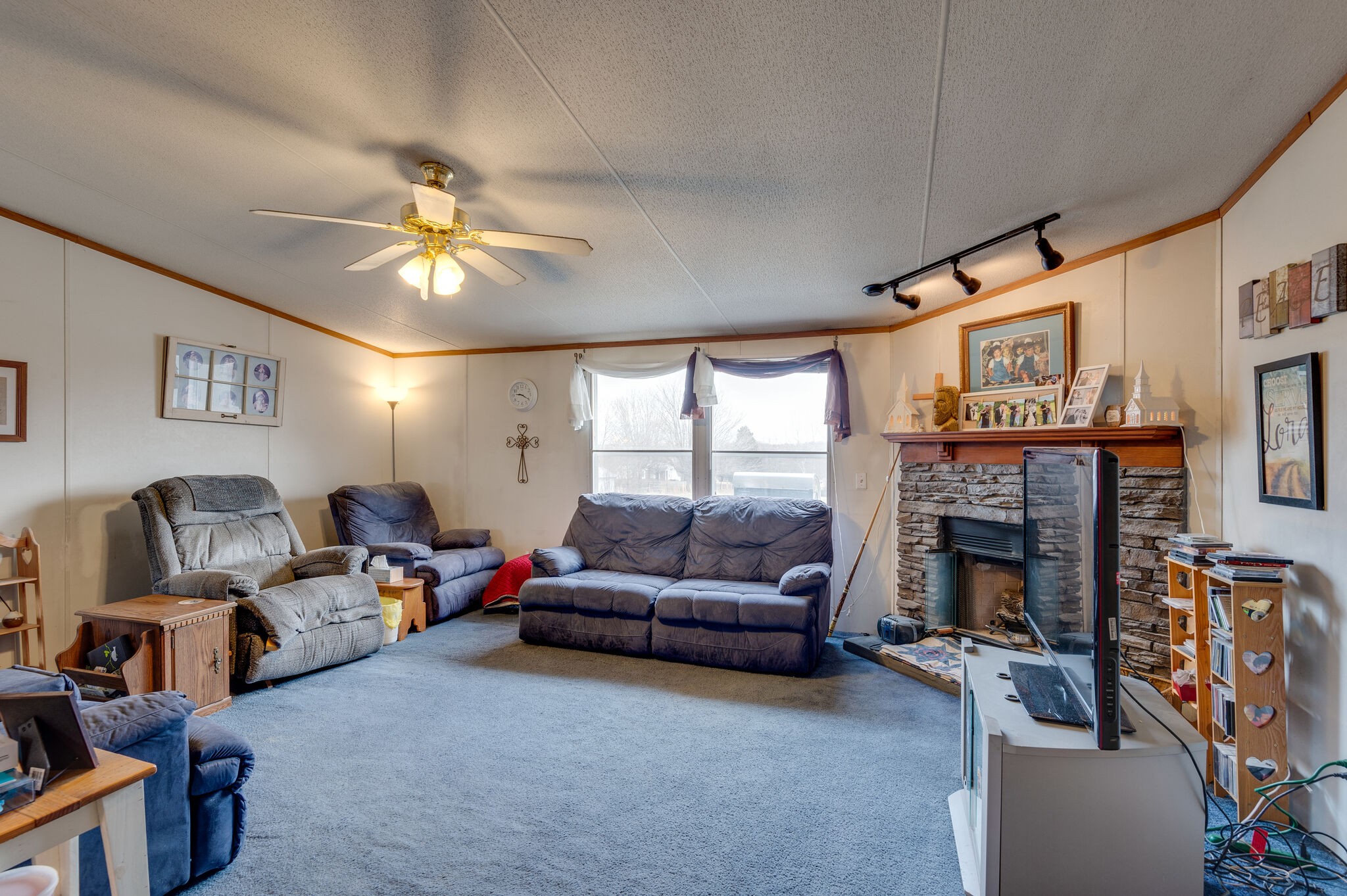 2848 Jack Teasley Road Pleasant View, TN 37146 - Photo 32 of 45 a living room with furniture a fireplace and a large window
