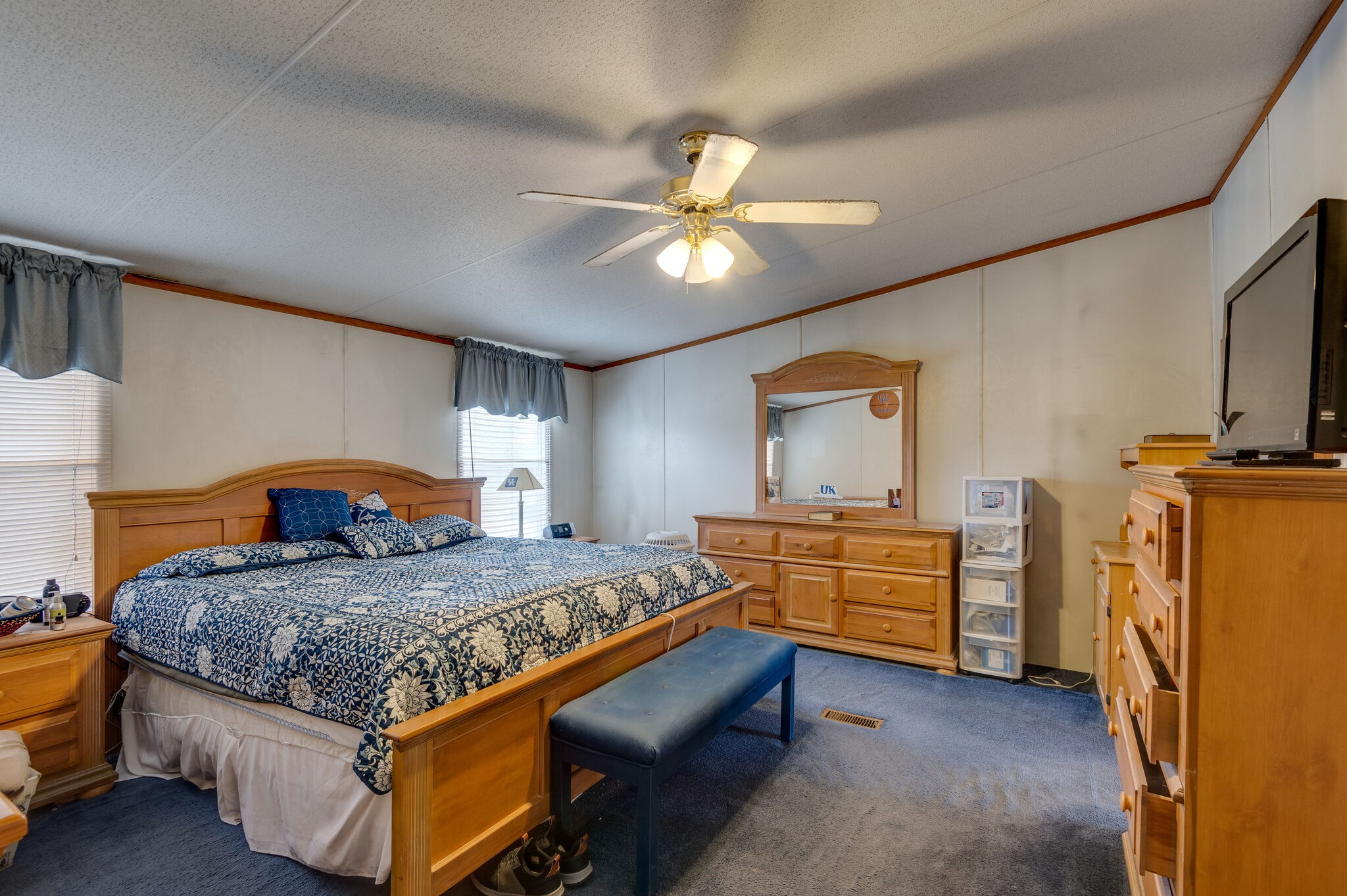 2848 Jack Teasley Road Pleasant View, TN 37146 - Photo 34 of 45 a bedroom with a bed and a chandelier