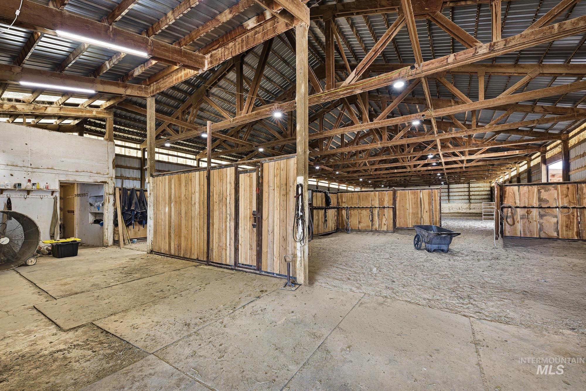 24900 Market Road Parma, ID 83660 - Photo 24 of 50 Spacious barn interior featuring exposed wood beam construction and high ceilings
