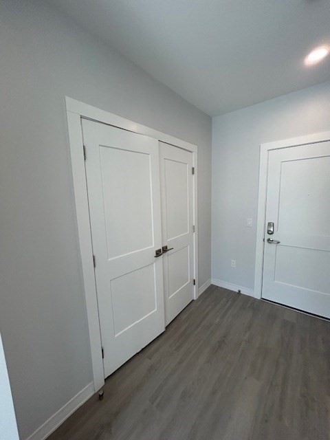 148 Old Post Road, Unit 218 Sharon, MA 02067 - Photo 13 of 17 an empty room with wooden floor