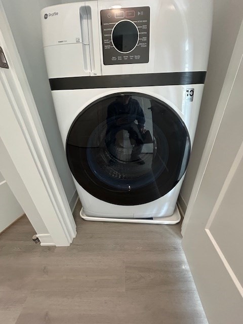 148 Old Post Road, Unit 218 Sharon, MA 02067 - Photo 16 of 17 a utility room with dryer and washer