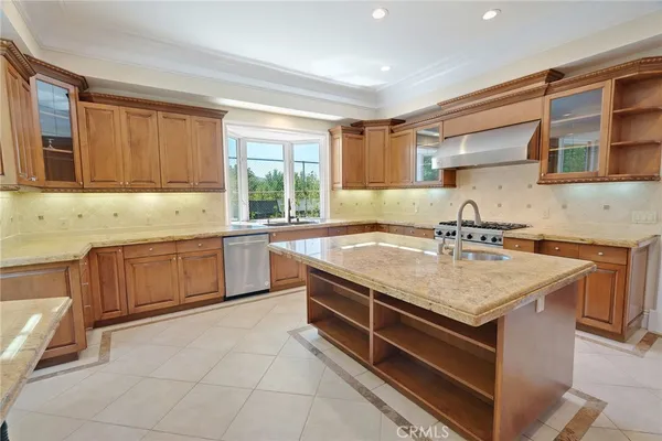 a white stove top oven sitting inside of a kitchen