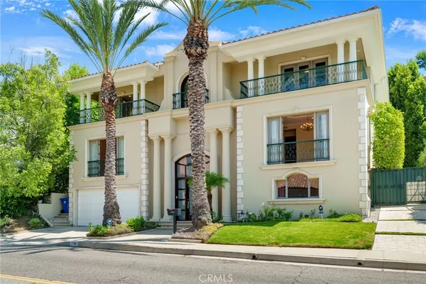 a view of a white building next to a road