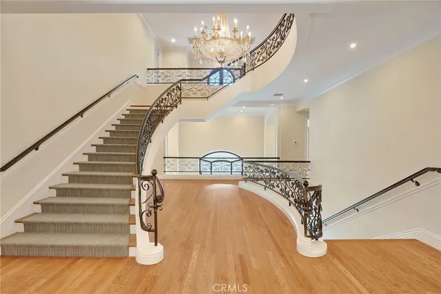 an entryway in hall with wooden floor