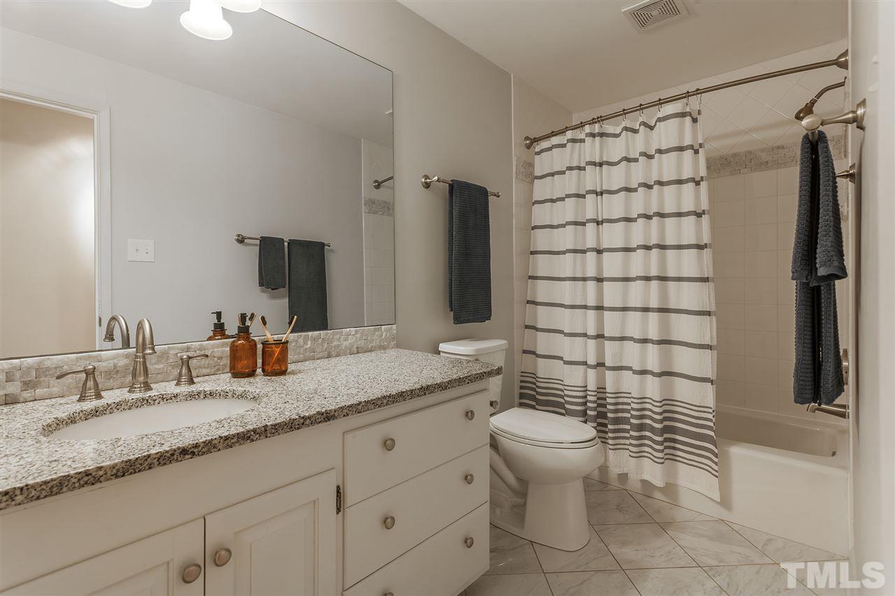 3903 Darby Road Durham, NC 27707 - Photo 23 of 30 This bathroom serves the two bedrooms opposite the master bedroom suite.
