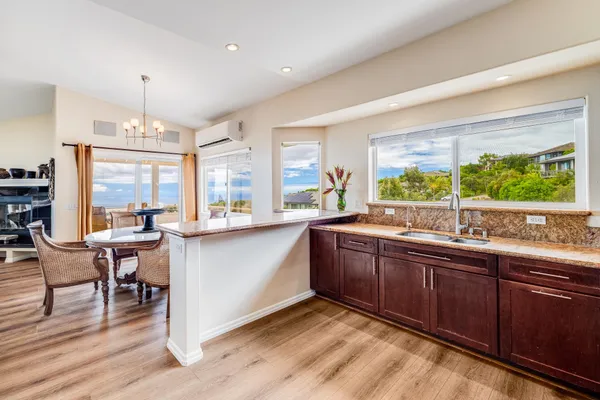 a kitchen with a sink and wooden cabinets