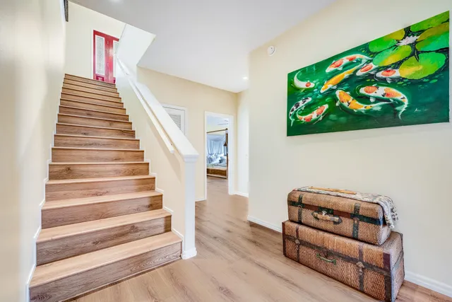 a view of staircase with wooden floor