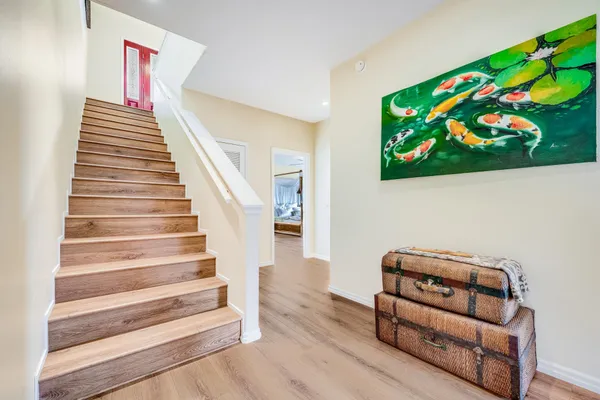 a view of staircase with wooden floor