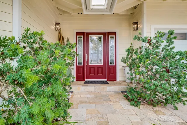 a front view of a house with lots of green space