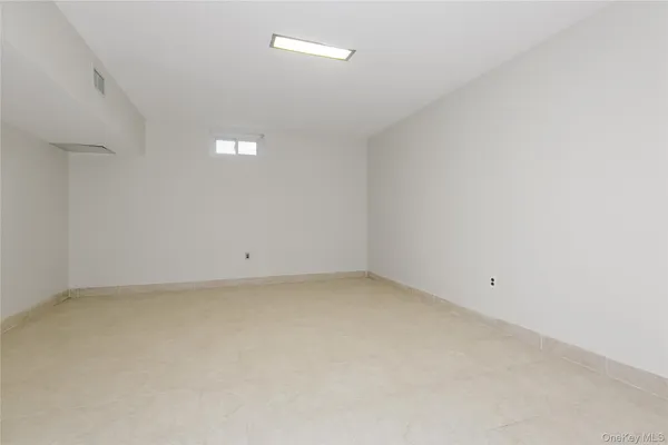 a bathroom with a toilet sink vanity and mirror