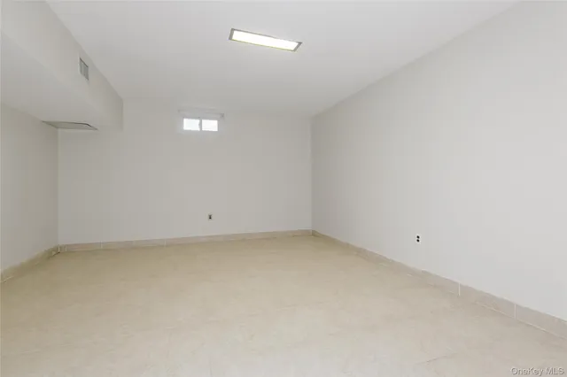 a bathroom with a toilet sink vanity and mirror