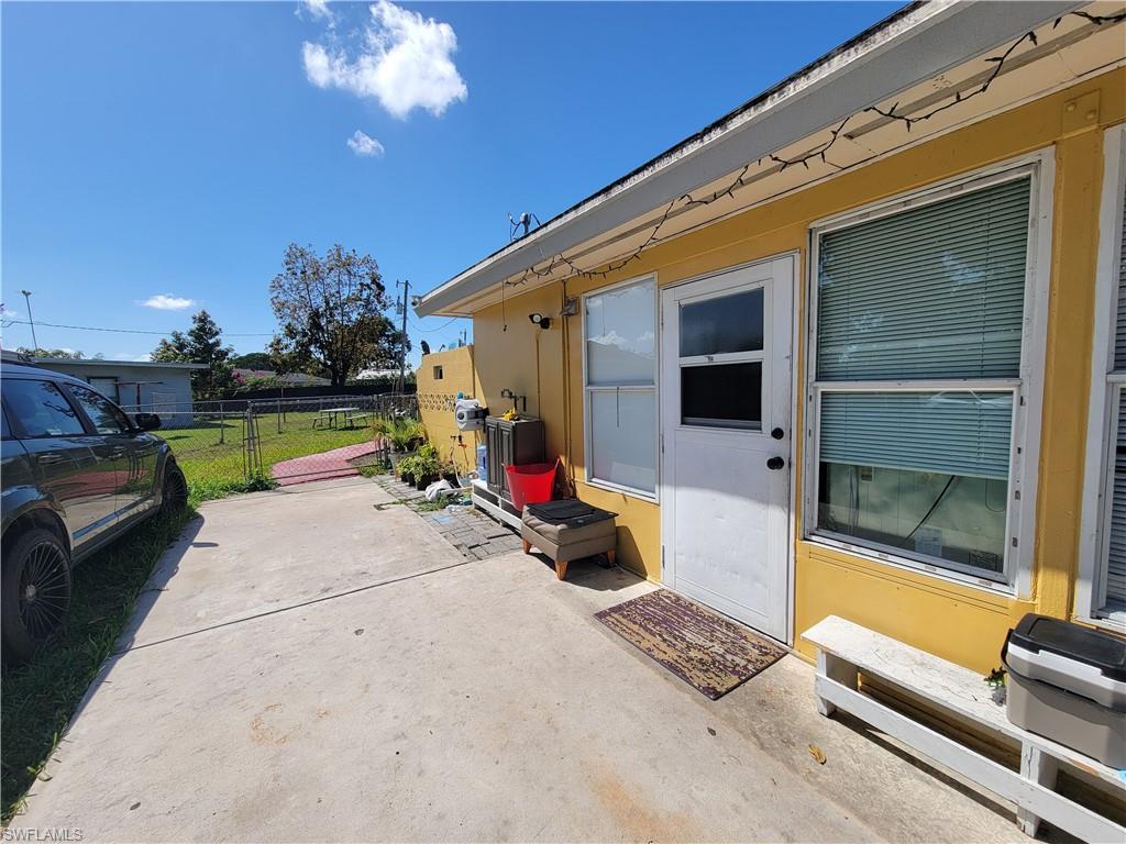 10 East Jersey Road Lehigh Acres, FL 33936 - Photo 2 of 32 View of patio / terrace with fence