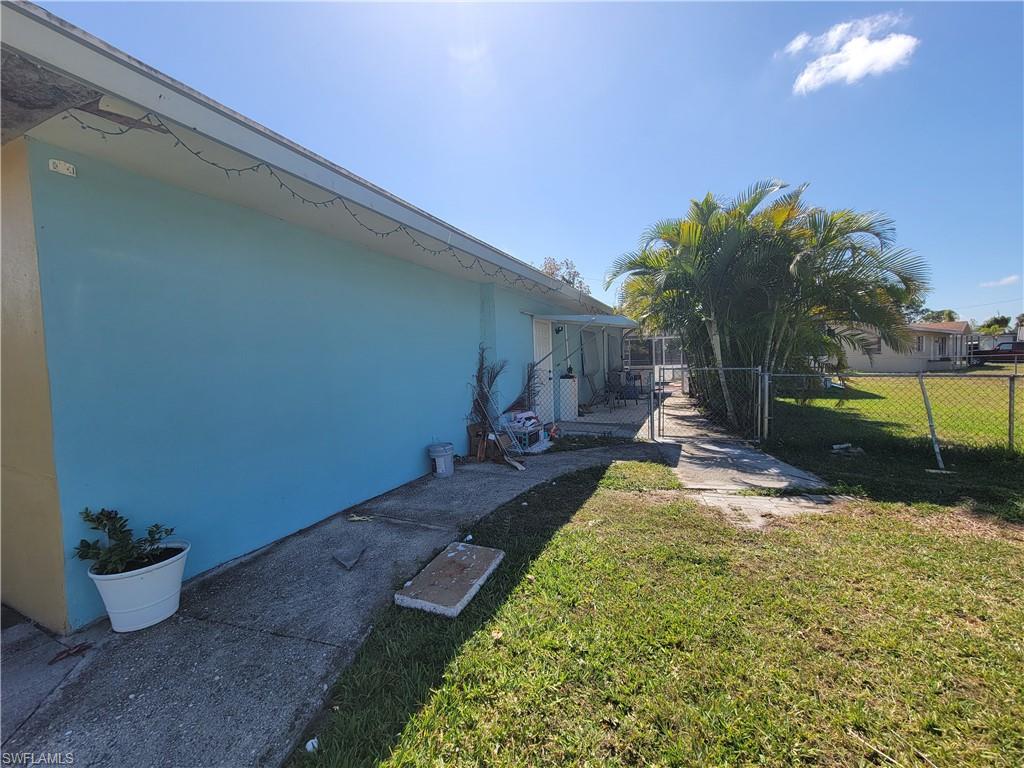 10 East Jersey Road Lehigh Acres, FL 33936 - Photo 27 of 32 View of yard featuring fence and a gate