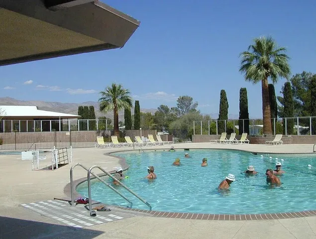 a view of a swimming pool with a lake
