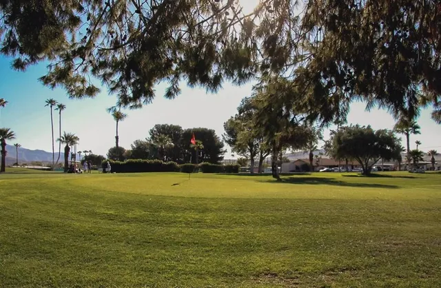 a view of a pool with chairs
