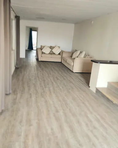 a living room with furniture and window