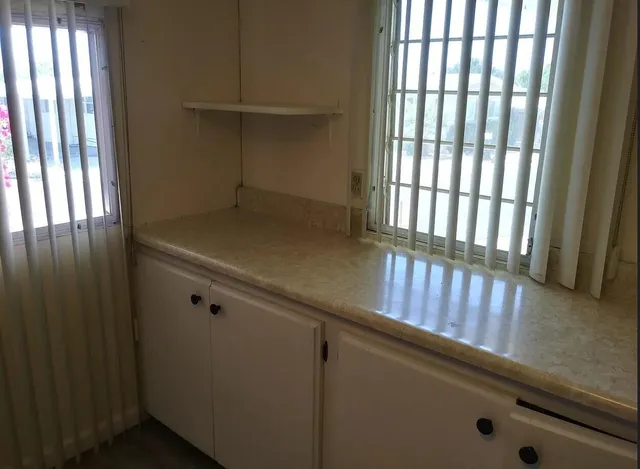 an empty room with wooden floor