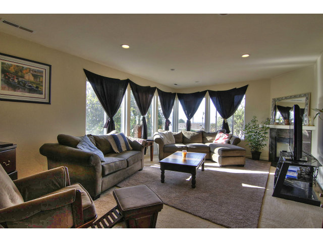 1289 Trinity Avenue Seaside, CA 93955 - Photo 5 of 13 a living room with furniture a rug and a large window