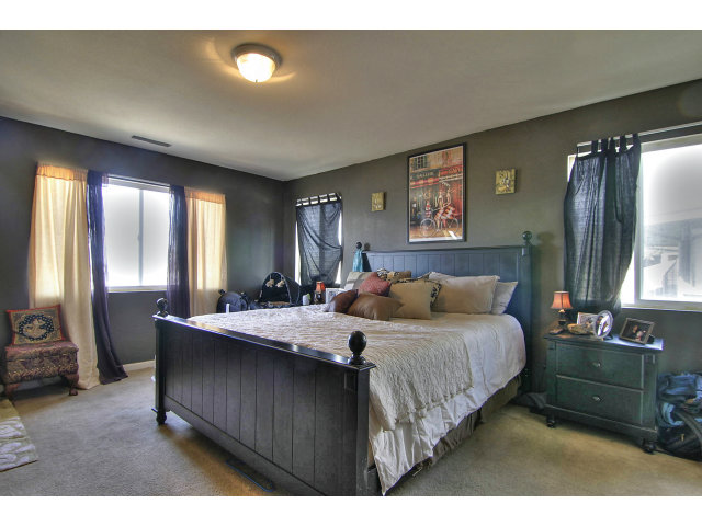 1289 Trinity Avenue Seaside, CA 93955 - Photo 7 of 13 a bedroom with a bed and window