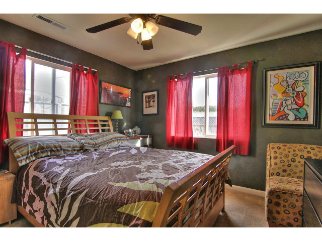 1289 Trinity Avenue Seaside, CA 93955 - Photo 9 of 13 a bed sitting in a bedroom next to a window