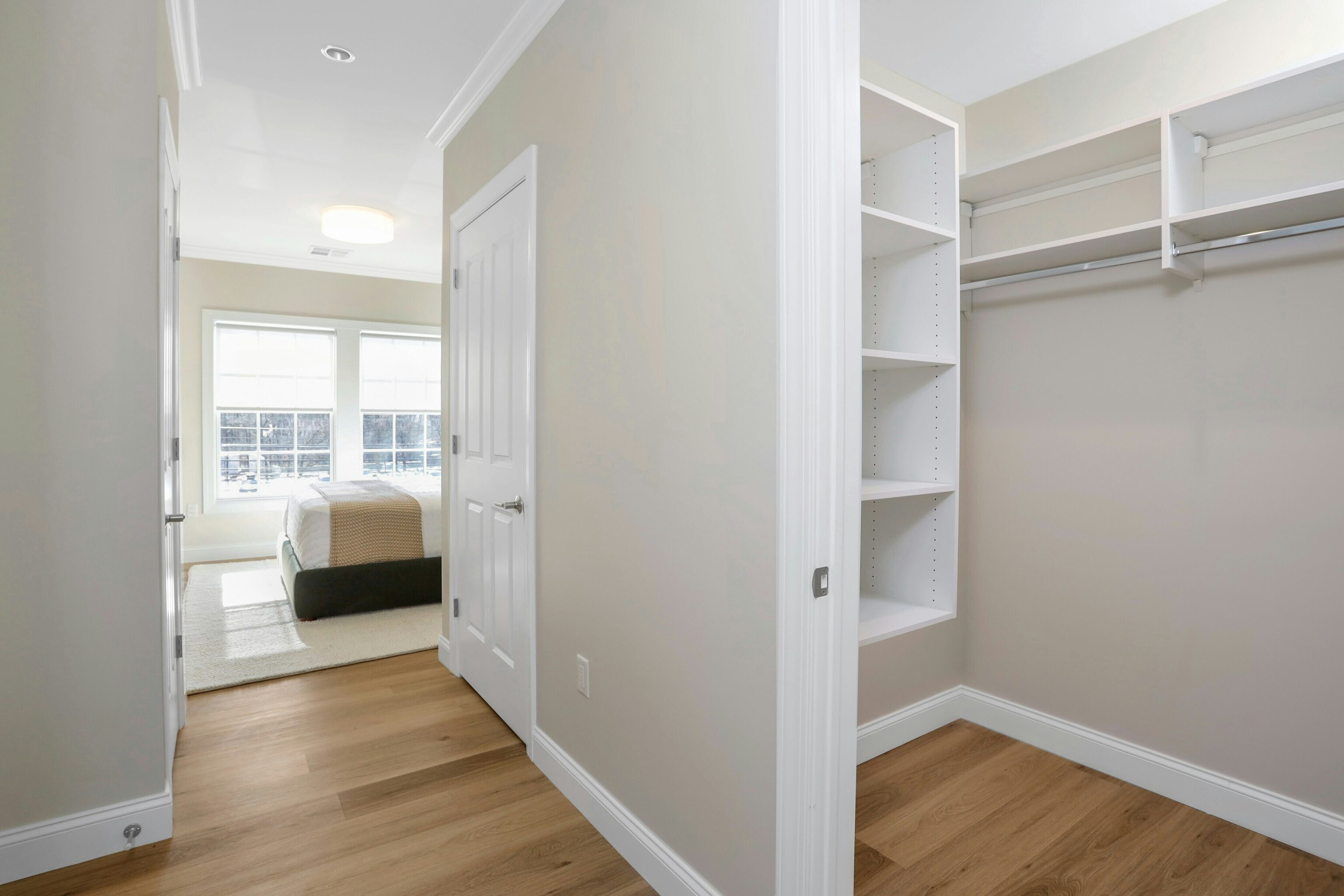340 Heights Road, Unit 202 Darien, CT 06820 - Photo 8 of 11 a view of walk in closet with wooden floor