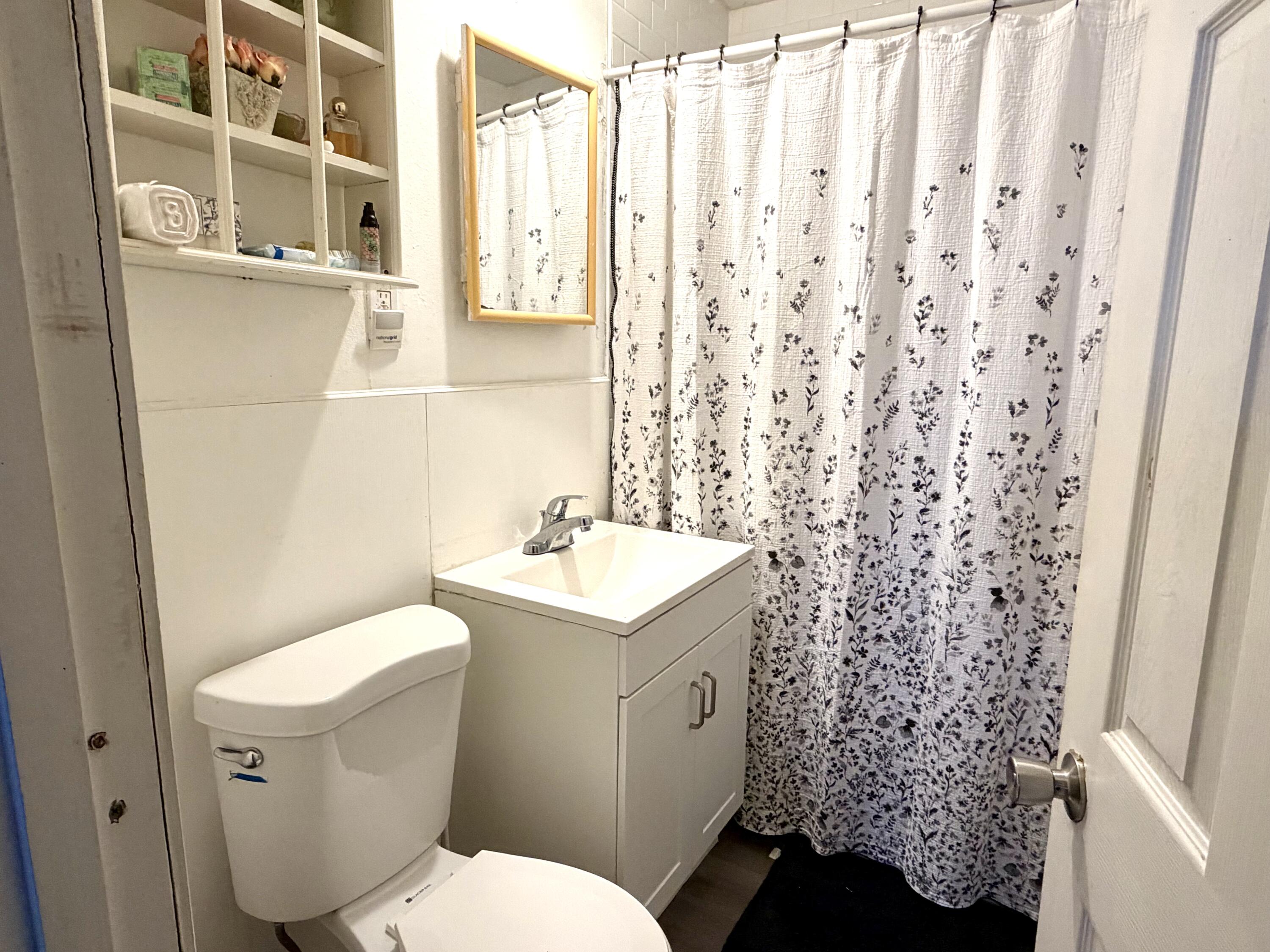 10 Hiramar Road, Unit 1012 Hyannis, MA 02601 - Photo 7 of 7 a bathroom with a sink toilet and shower
