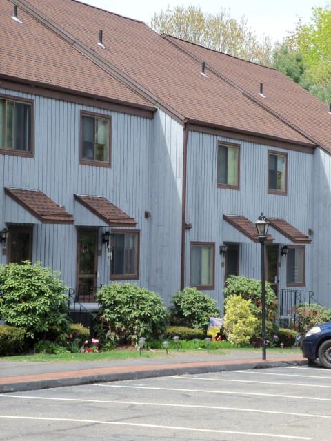21 Linden Street, Unit 22 Norwalk, CT 06851 - Photo 1 of 1 a front view of a house with a yard