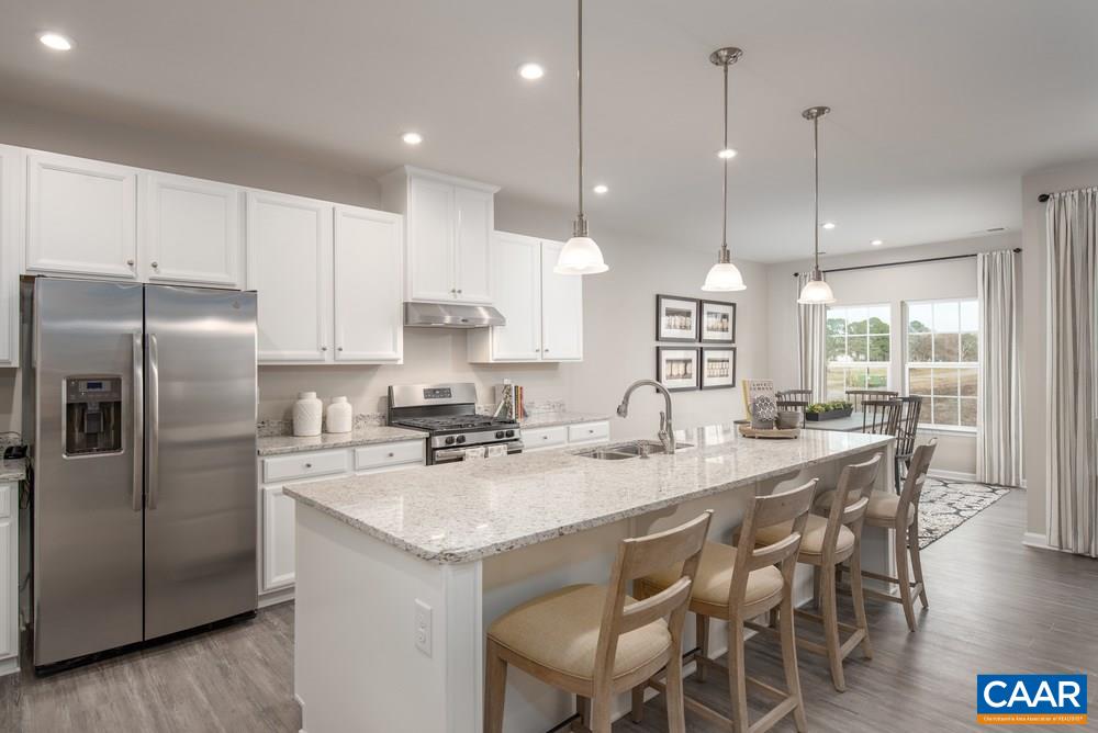65 Broken Island Road Palmyra, VA 22963 - Photo 3 of 18 a kitchen with granite countertop a center island a sink stainless steel appliances and cabinets