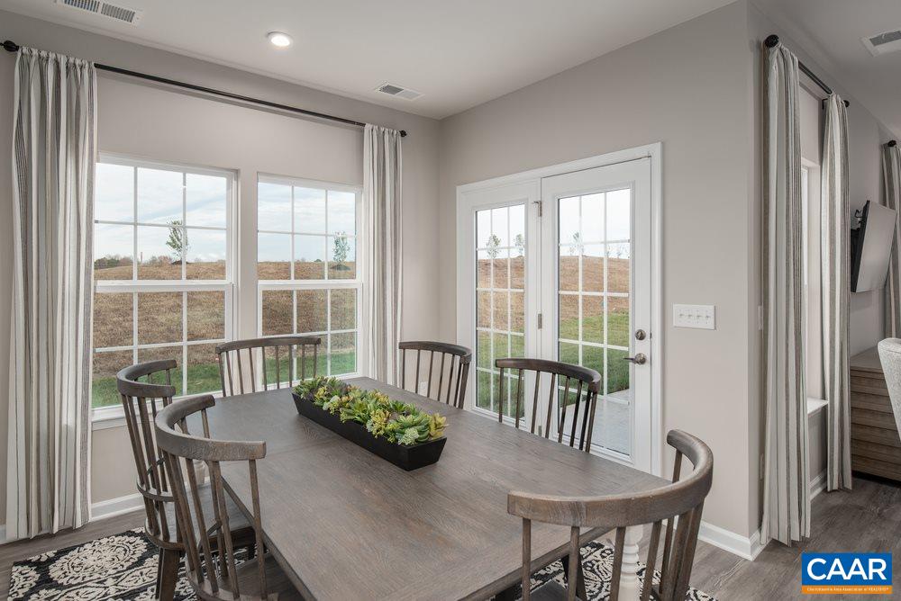 65 Broken Island Road Palmyra, VA 22963 - Photo 9 of 18 a view of a dining room with furniture window and outside view