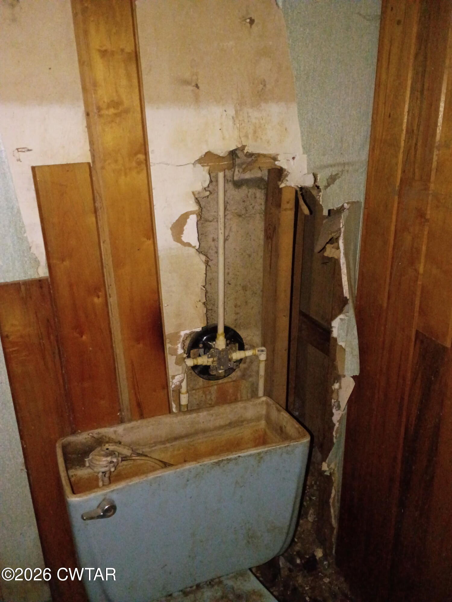 180 Dale Road Henry, TN 38231 - Photo 12 of 26 a room with water heater and wooden cabinets