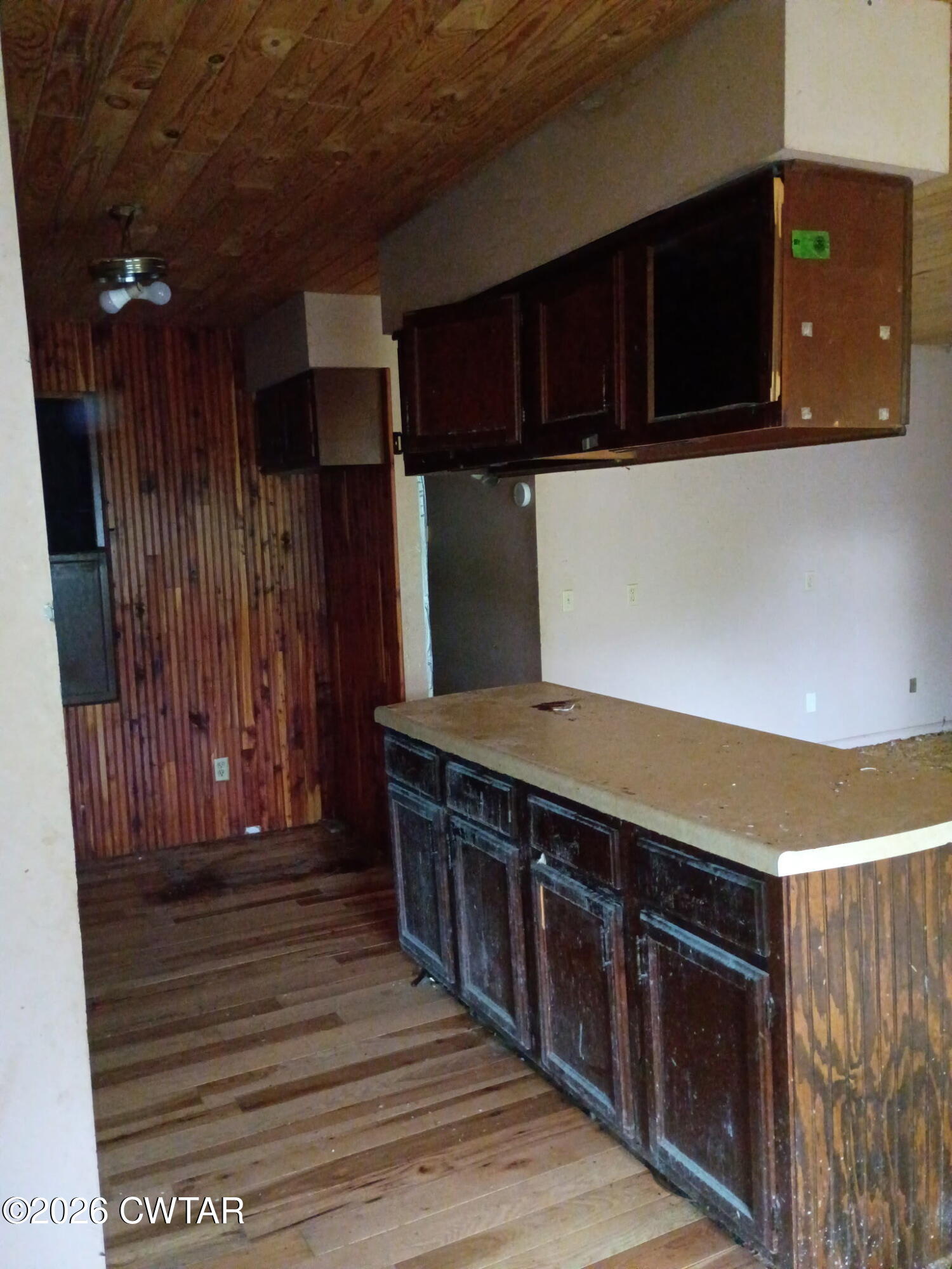 180 Dale Road Henry, TN 38231 - Photo 17 of 26 a kitchen with stainless steel appliances wooden cabinets and a stove top oven