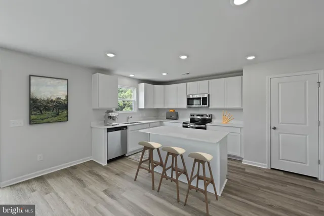 a kitchen with a table and chairs in it