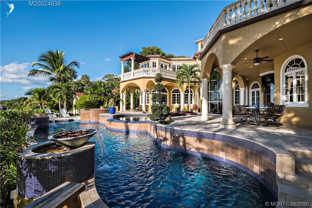 173 South River Road Stuart, FL 34996 - Photo 2 of 2 a view of a building with swimming pool