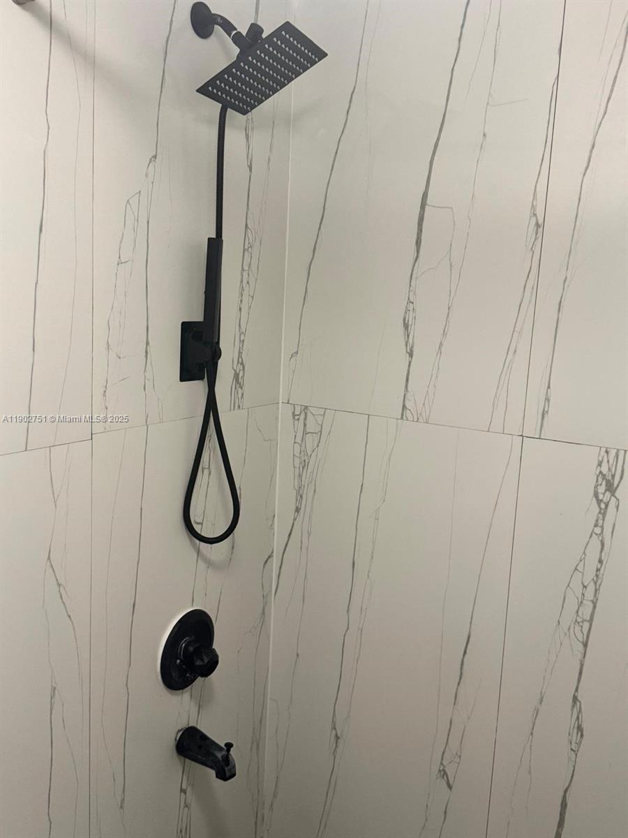 3955 North Nob Hill Road, Unit 101 Sunrise, FL 33351 - Photo 17 of 19 a bathroom with a shower