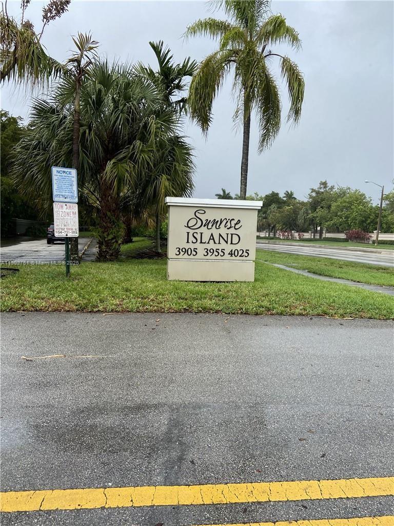 3955 North Nob Hill Road, Unit 101 Sunrise, FL 33351 - Photo 2 of 19 a sign that is on the side of a road