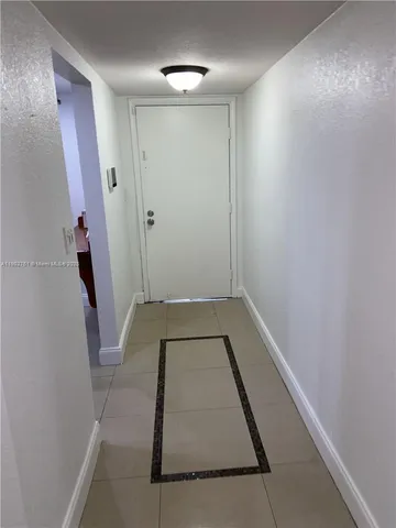 a bathroom with a tub and shower