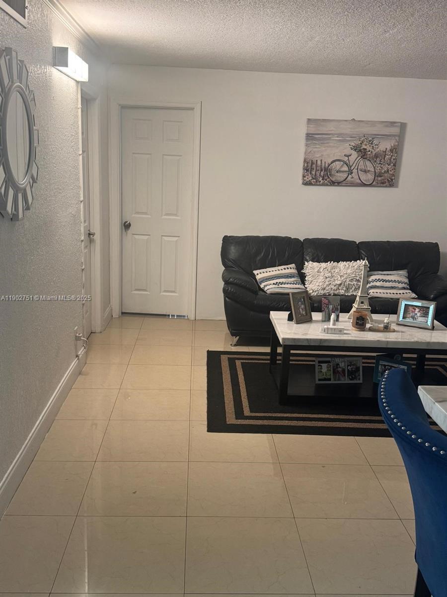 3955 North Nob Hill Road, Unit 101 Sunrise, FL 33351 - Photo 4 of 19 a living room with furniture