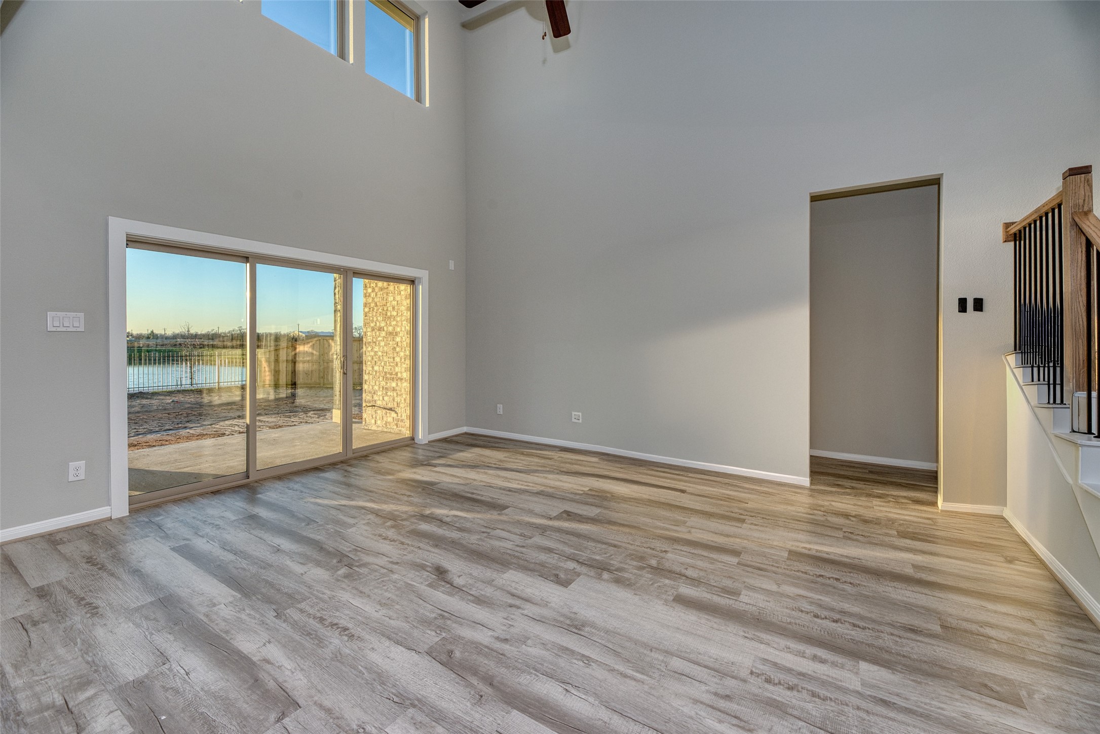 21122 Sunlight Grv Drive Rosharon, TX 77583 - Photo 14 of 45 a view of an empty room with wooden floor and a window