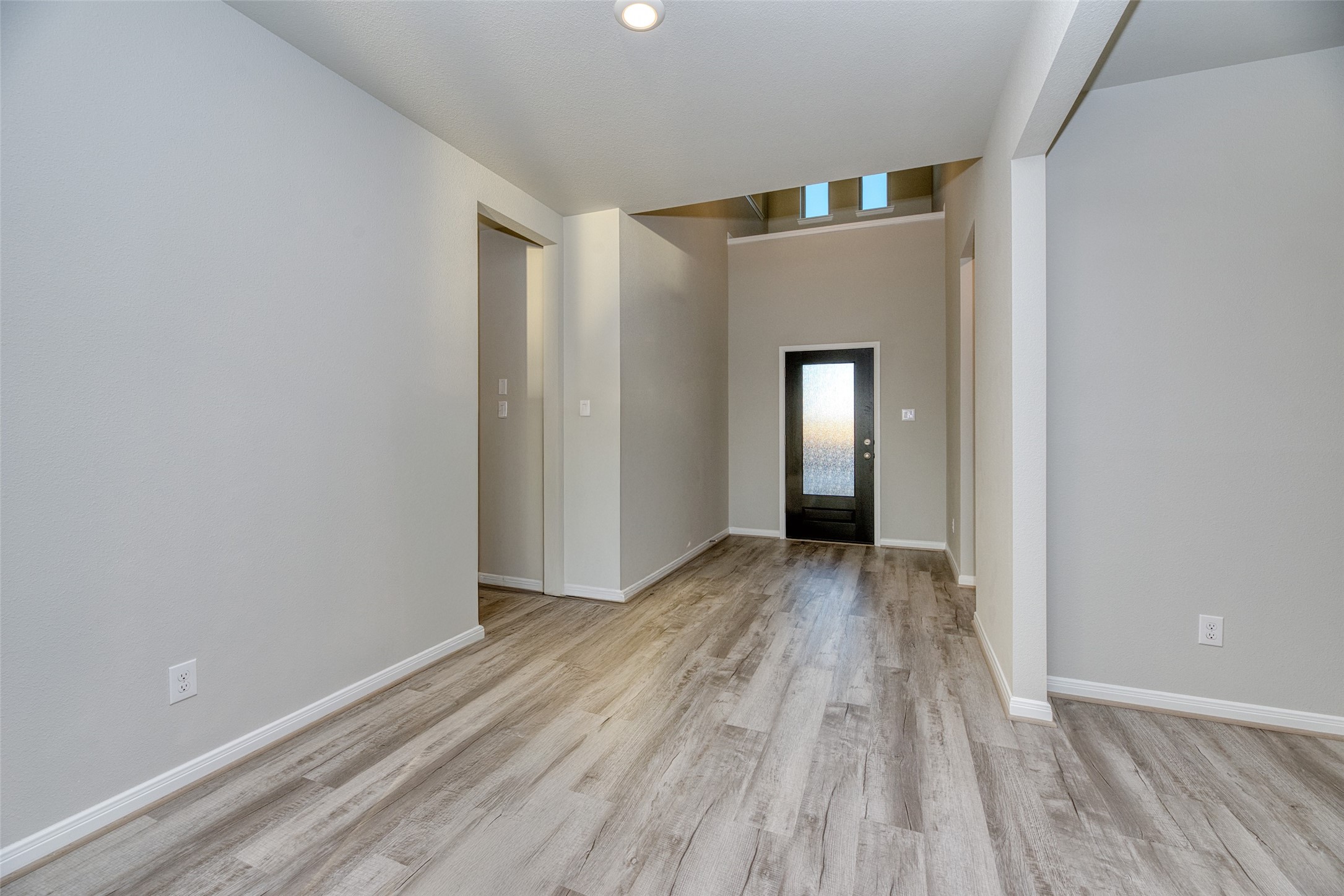 21122 Sunlight Grv Drive Rosharon, TX 77583 - Photo 15 of 45 a view of an empty room with wooden floor and a window