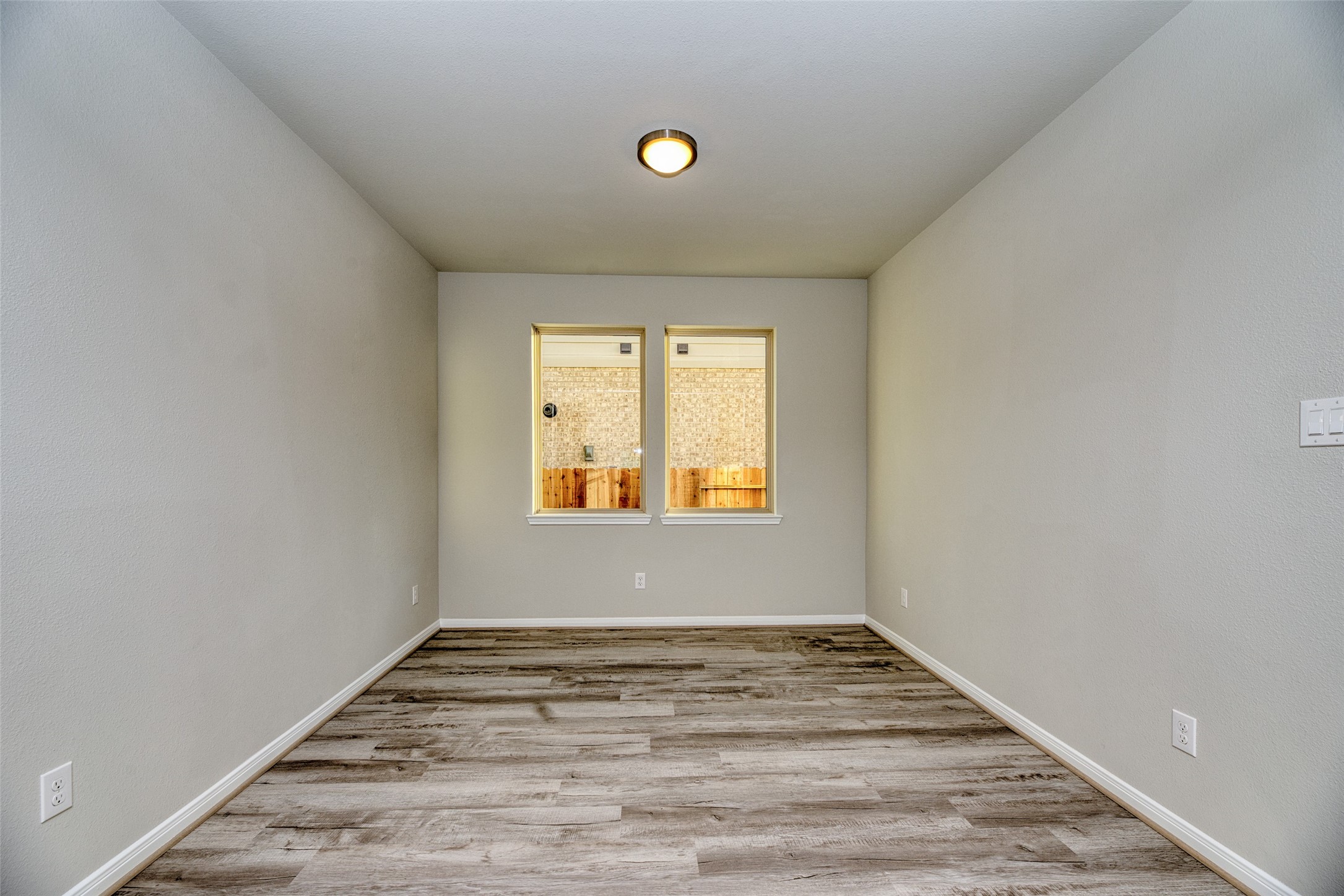 21122 Sunlight Grv Drive Rosharon, TX 77583 - Photo 16 of 45 a view of empty room with wooden floor